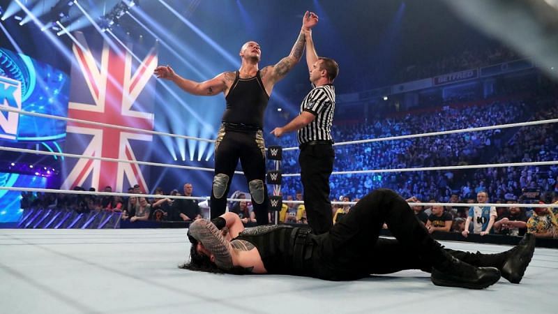 Corbin celebrating his victory against Reigns